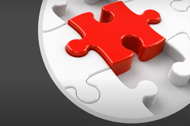 Red piece being placed in a white puzzle.